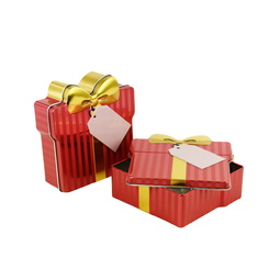 Irregular shapes: Schmuckdose Geschenkdose rot gestreift mit goldener stilisierter Schleife, Weißblechdose halb geöffnet im Vordergrund liegend, zweite geschlossen stehend