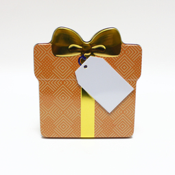 Naše produkty: Schmuckdose Geschenkdose orangenes Muster mit goldener stilisierter Schleife, Weißblechdose Draufsicht stehend